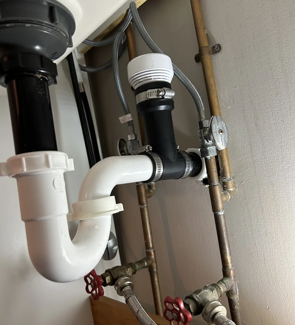 Fernco Inline AAV Kit installed on the trap arm under a bathroom sink