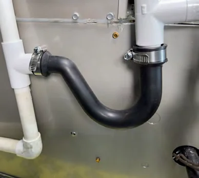 Finished installation of the Fernco condensate trap on an HVAC unit
