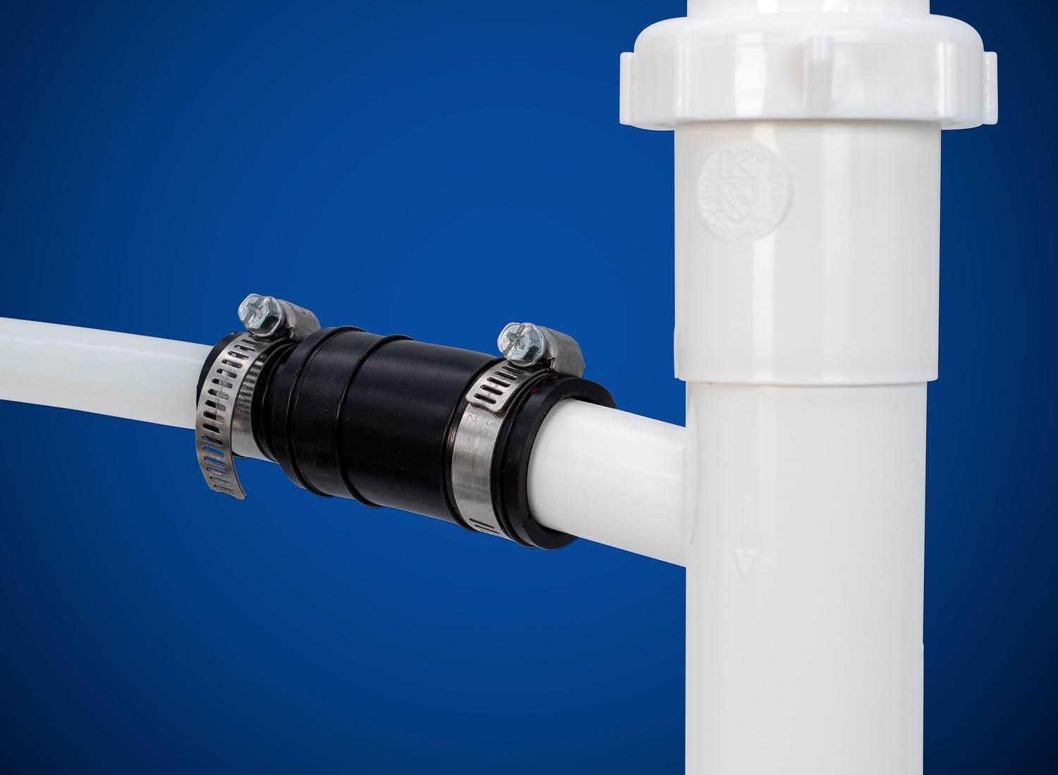 Fernco Dishwasher Drain Connector joining a drain hose to the side outlet of a dishwasher branch tailpiece