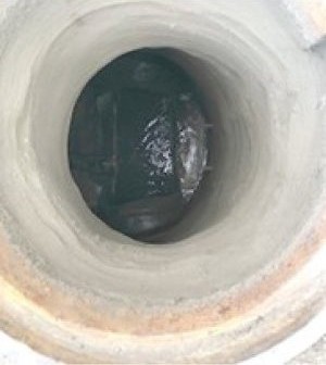Manhole after patching and the High Performance Mix liner