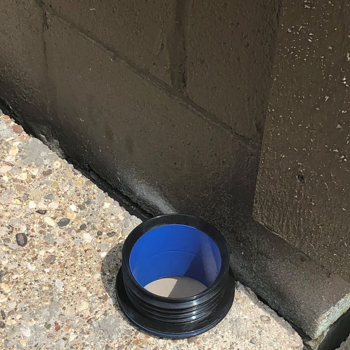 ICON pushed into a pipe stub cut off flush in a concrete slab