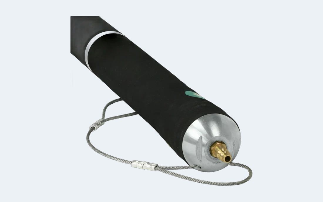 A PipePatch packer with its air fitting and pull cable