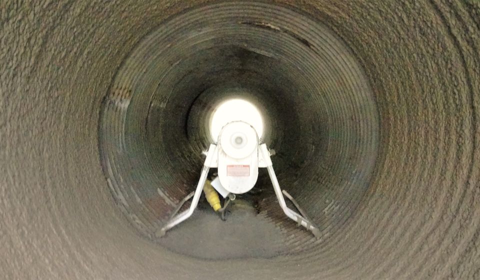 A Strong-Seal spincaster lining a corrugated metal culvert from the inside