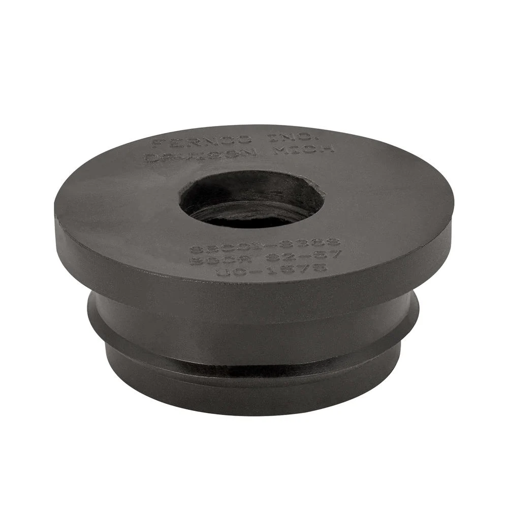 Fernco Utility Connector, a black stepped rubber bushing with a center hole for the small line